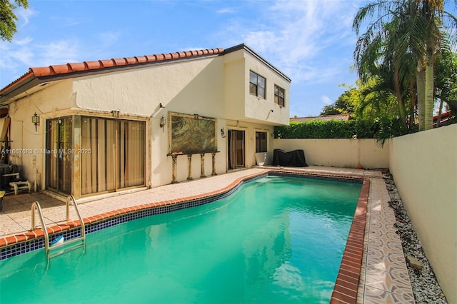 view of swimming pool with a fenced in pool and a fenced backyard