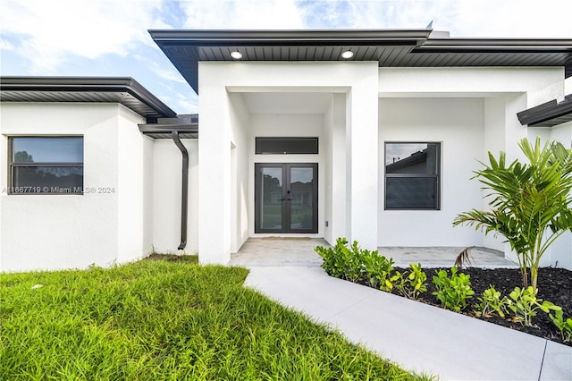 view of exterior entry with french doors