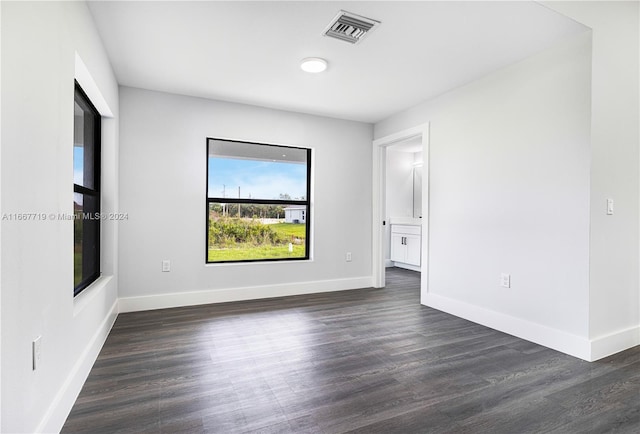 spare room featuring dark hardwood / wood-style floors