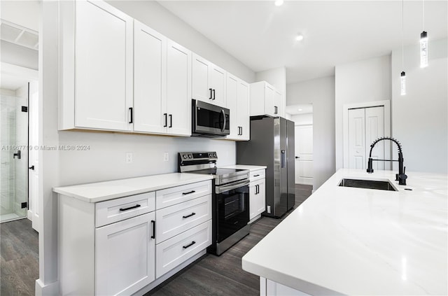 kitchen featuring sink, white cabinetry, and stainless steel appliances