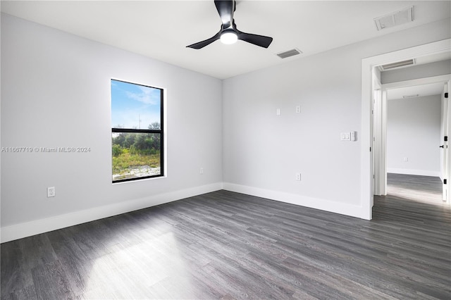 unfurnished room featuring ceiling fan and dark hardwood / wood-style flooring