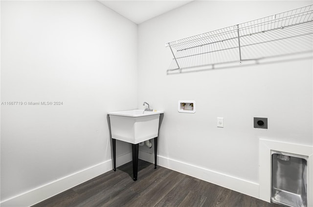 laundry room featuring hookup for an electric dryer, hookup for a washing machine, and dark hardwood / wood-style flooring