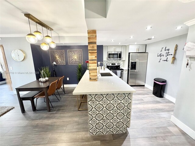 living room featuring ornamental molding and wood-type flooring