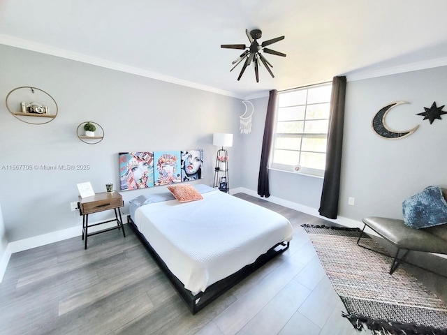 bedroom featuring ceiling fan and ornamental molding