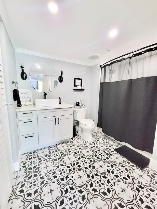 bathroom with vanity, toilet, crown molding, and a shower with shower curtain