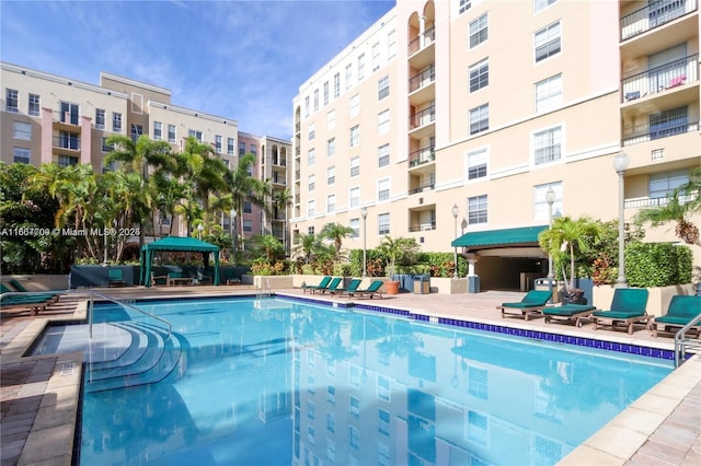 view of swimming pool with a patio area and a gazebo