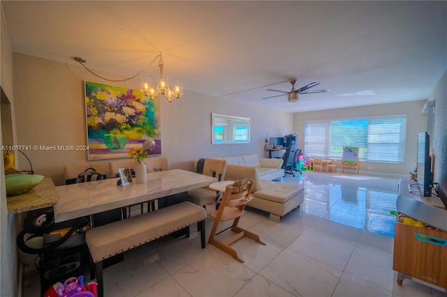 dining room featuring ceiling fan with notable chandelier