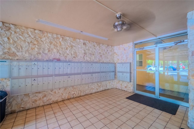 spare room with mail boxes and light tile patterned floors