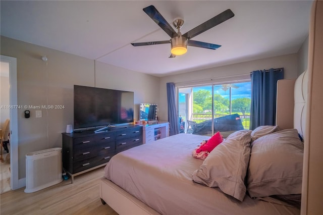 bedroom featuring light wood-type flooring, access to outside, and ceiling fan