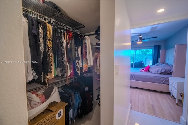 spacious closet with wood-type flooring and ceiling fan