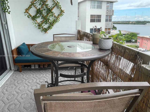 balcony featuring a water view