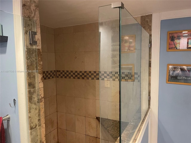 bathroom with tiled shower