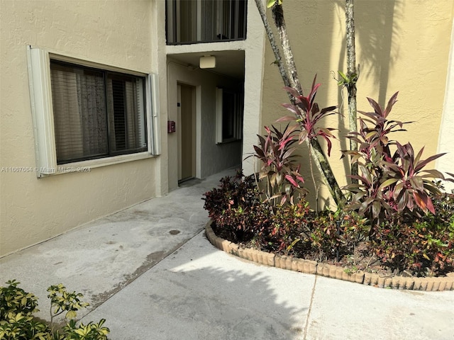 doorway to property featuring a patio area