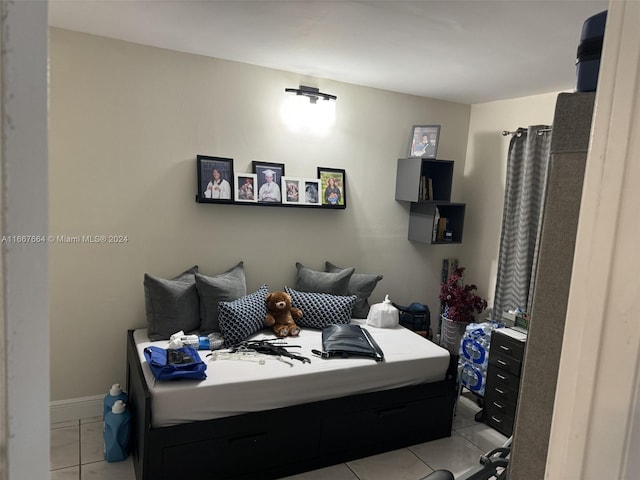 bedroom with light tile patterned floors