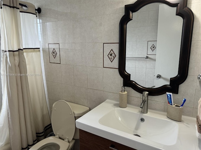 bathroom with tile walls, tasteful backsplash, vanity, walk in shower, and toilet