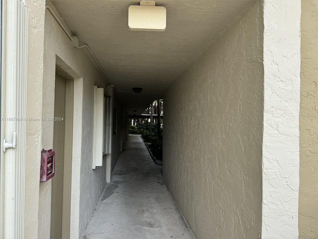 hall featuring concrete floors