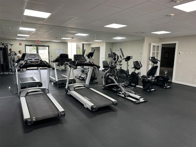 workout area with a paneled ceiling