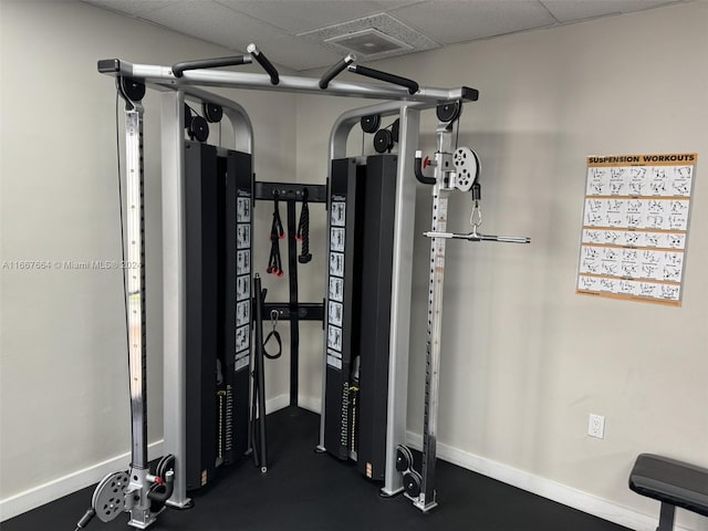 exercise area with a paneled ceiling