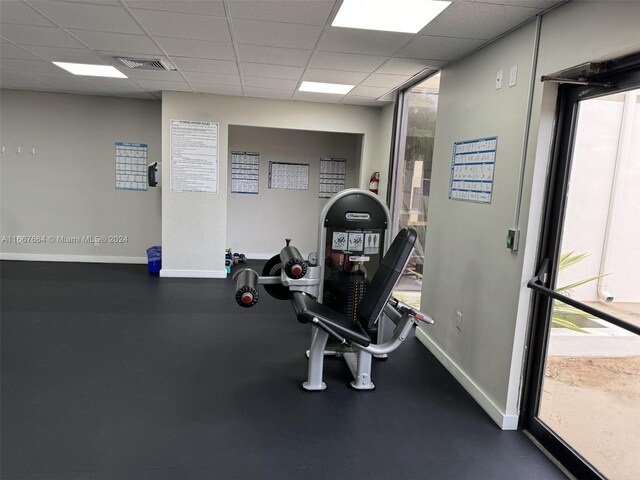 workout area with a drop ceiling