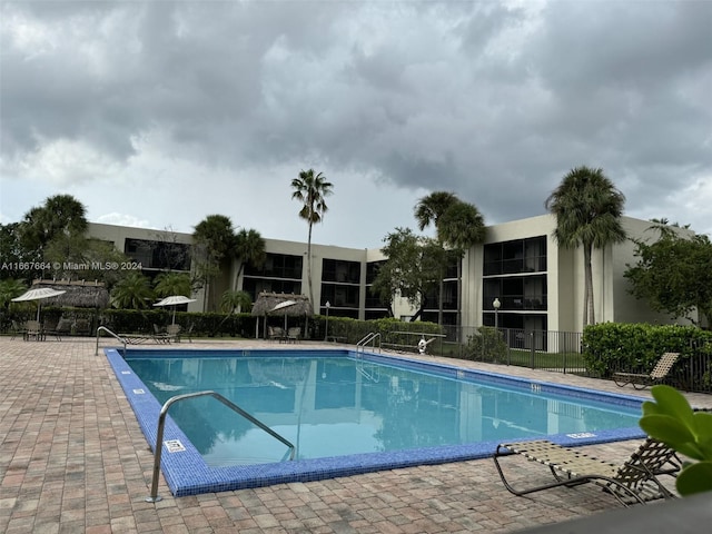 view of swimming pool with a patio