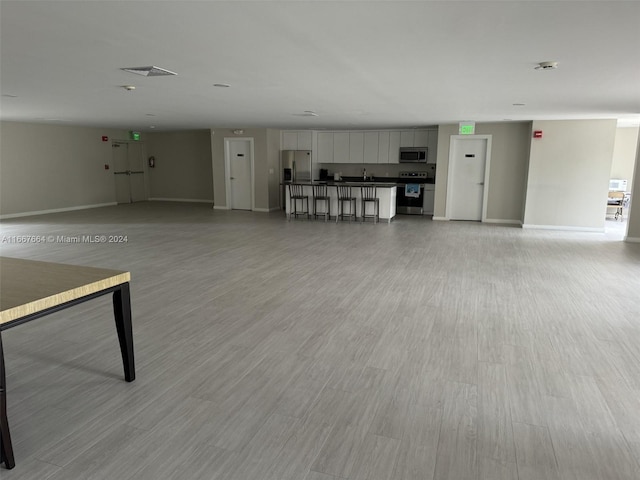 unfurnished living room with light wood-type flooring