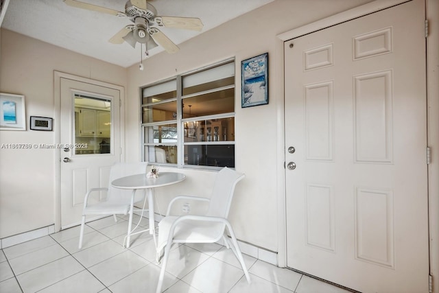 dining room featuring ceiling fan and light tile patterned flooring