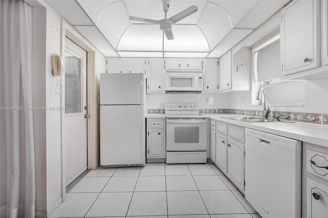 kitchen with white cabinets, white appliances, light tile patterned floors, ceiling fan, and sink