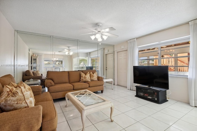 tiled living room with a textured ceiling and ceiling fan