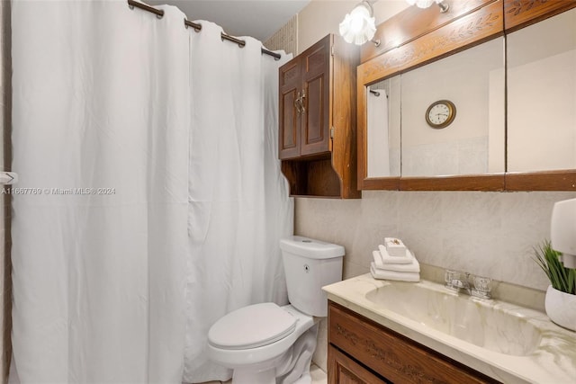 bathroom featuring curtained shower, tile walls, vanity, and toilet