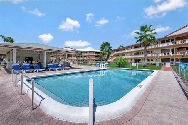 view of swimming pool with a patio