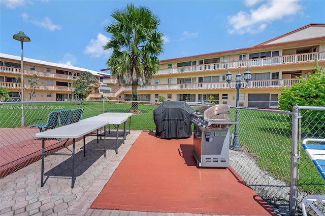 view of patio / terrace featuring a balcony and a grill