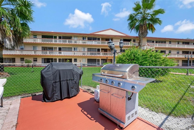 view of patio / terrace with grilling area and a balcony