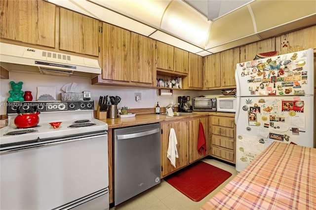 kitchen with white appliances and sink