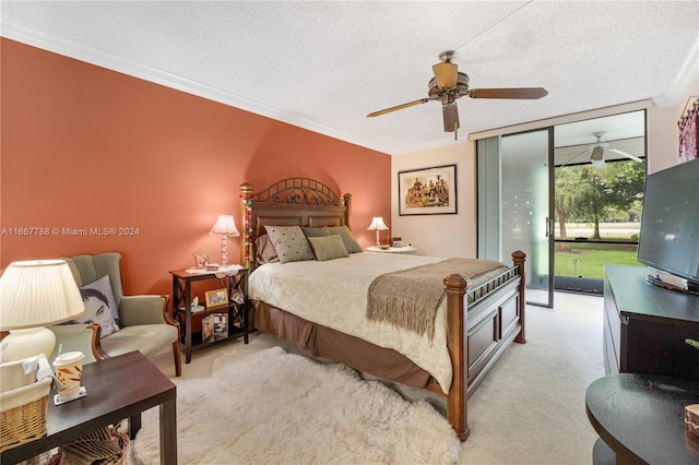 carpeted bedroom with ornamental molding, ceiling fan, access to outside, and a textured ceiling