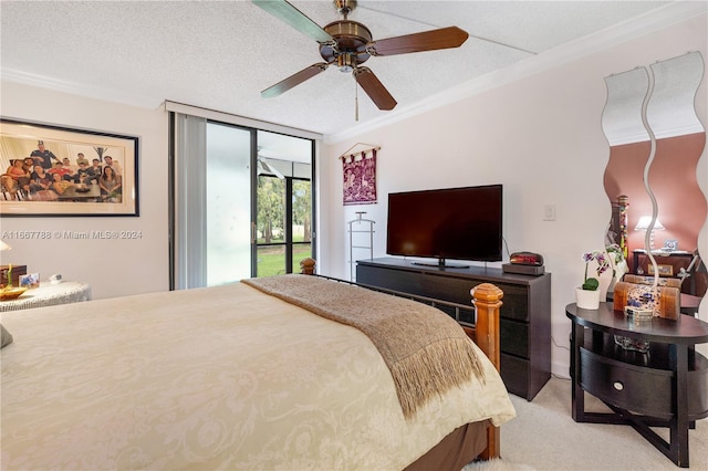 bedroom featuring ceiling fan, access to outside, a textured ceiling, light colored carpet, and crown molding