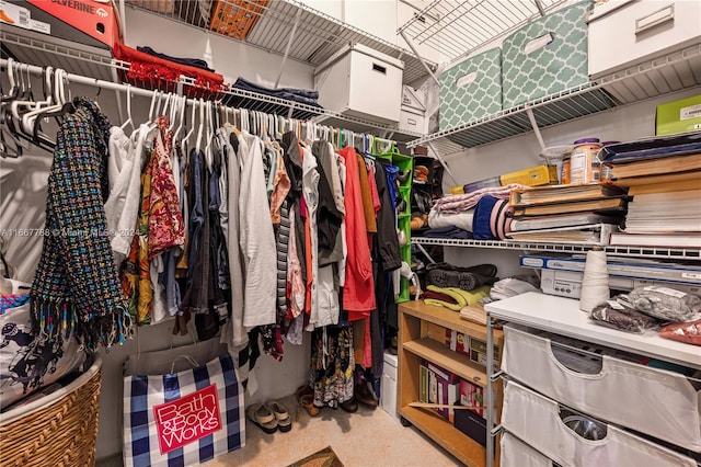 spacious closet featuring carpet floors