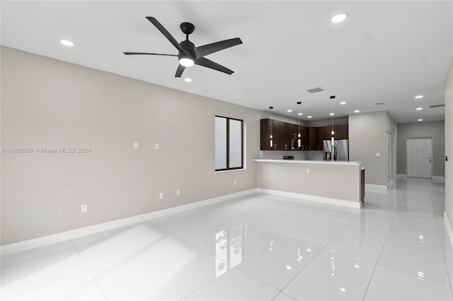 interior space featuring ceiling fan and light tile patterned floors