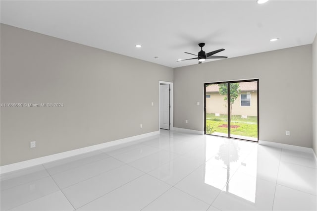 tiled empty room with ceiling fan