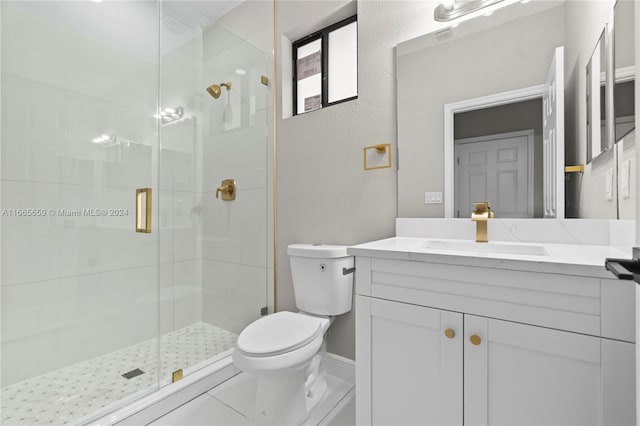 bathroom featuring walk in shower, vanity, tile patterned flooring, and toilet