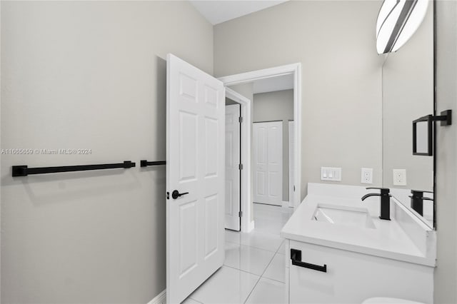 bathroom with tile patterned flooring and vanity