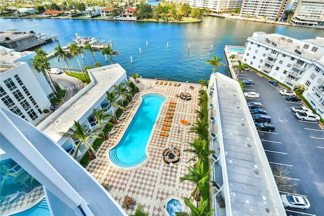 birds eye view of property with a water view