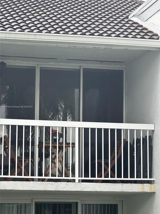 view of side of home with a balcony