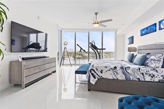 tiled bedroom featuring ceiling fan and access to outside