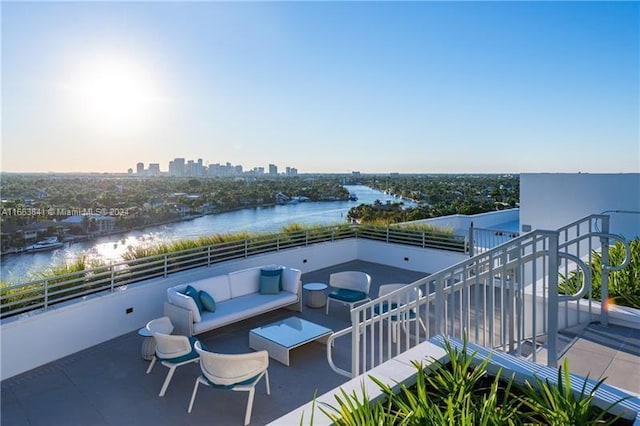 view of patio / terrace with an outdoor living space and a water view