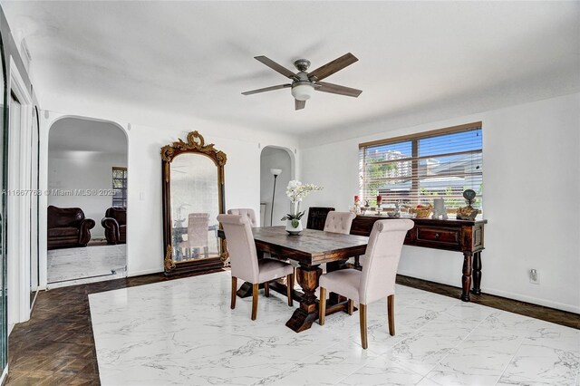 dining space with ceiling fan