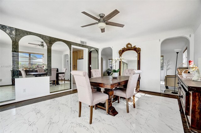 dining room featuring ceiling fan and light wood-type flooring