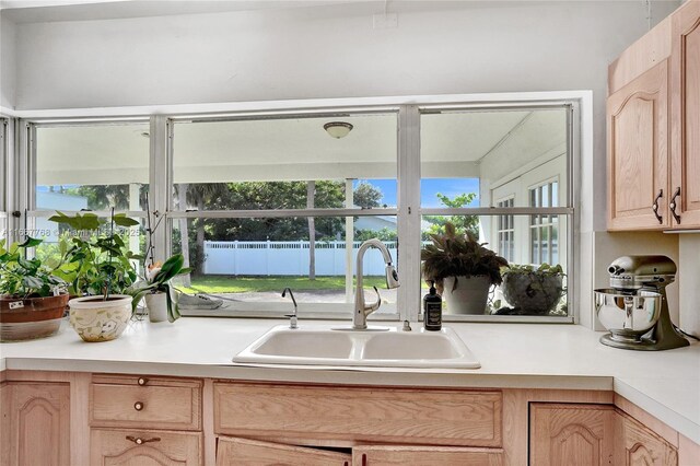 kitchen featuring light brown cabinets and sink