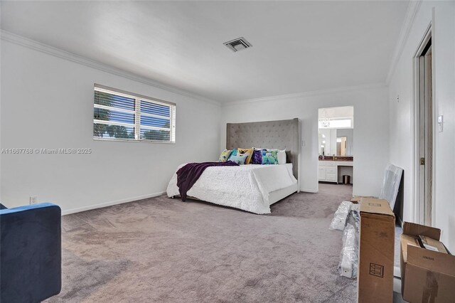 carpeted bedroom with connected bathroom and ornamental molding