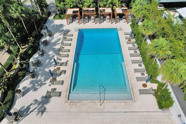 view of pool with tennis court