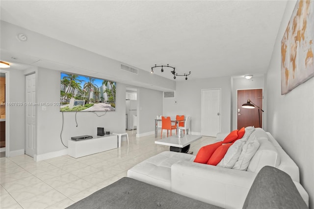 living room with a textured ceiling